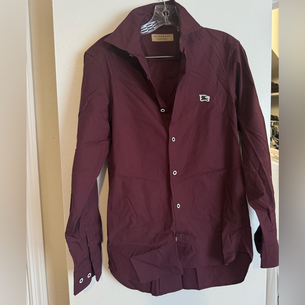 Dress shirt wine color with little use size xs .US